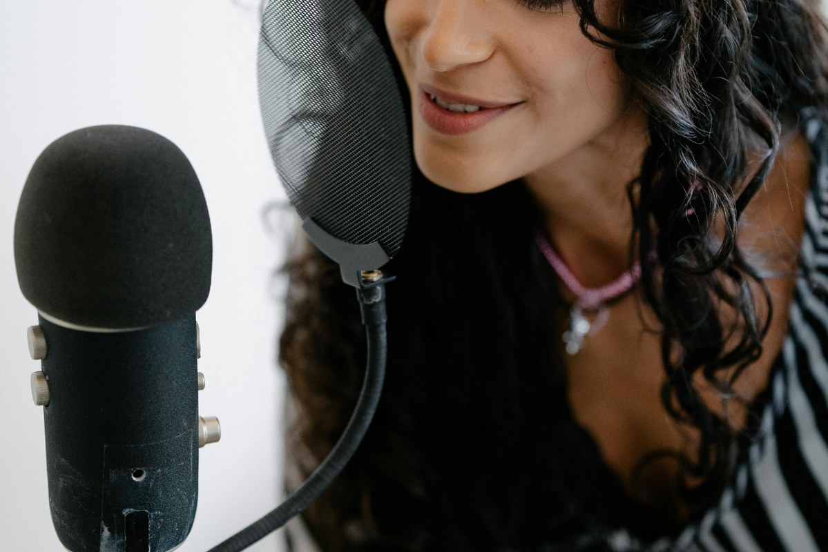 Woman speaking on microphone.