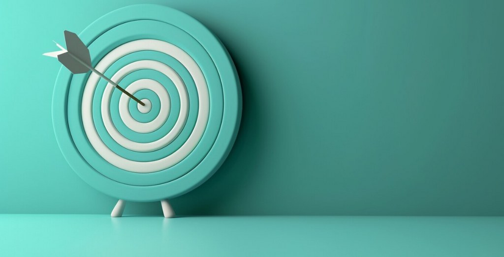 A dart at the centre of a bullseye.