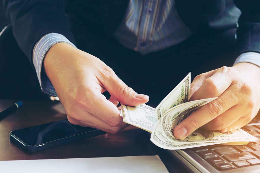 A man counting money.