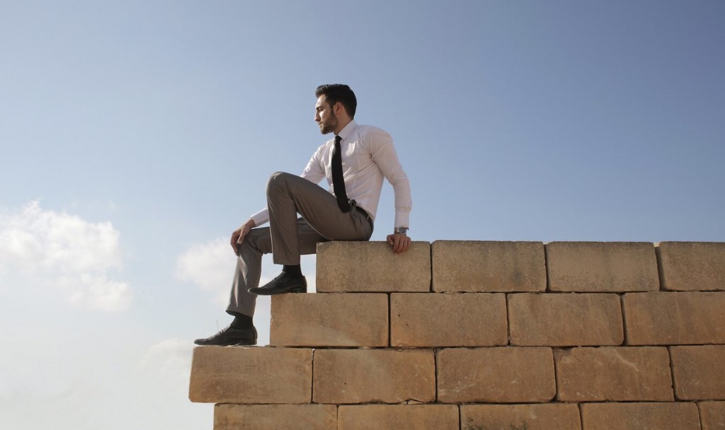 A man on a wall.