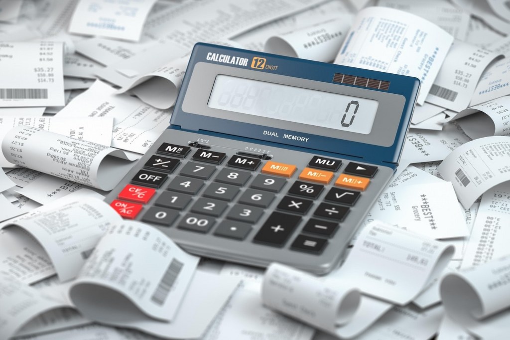 Business receipts and a calculator.