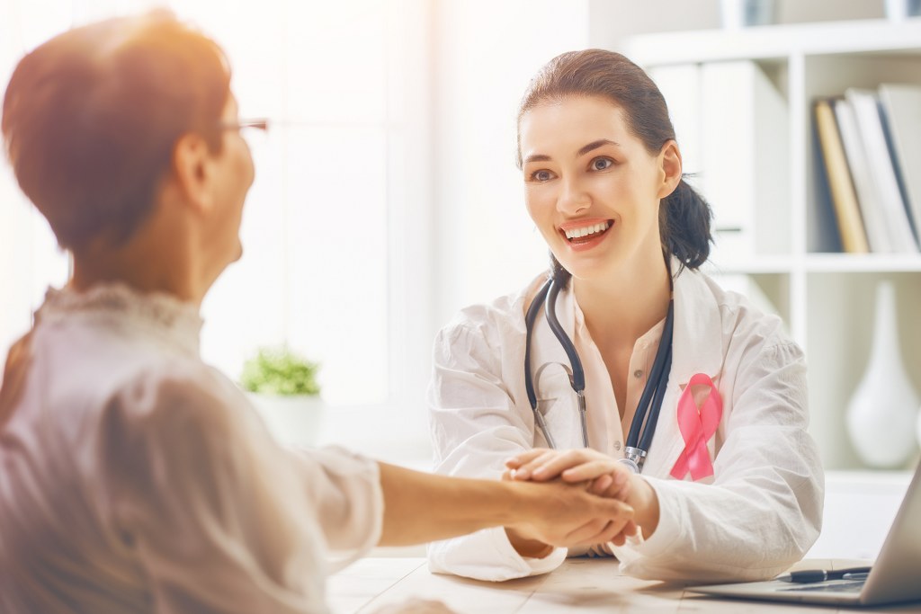 Female doctor listening to patient.