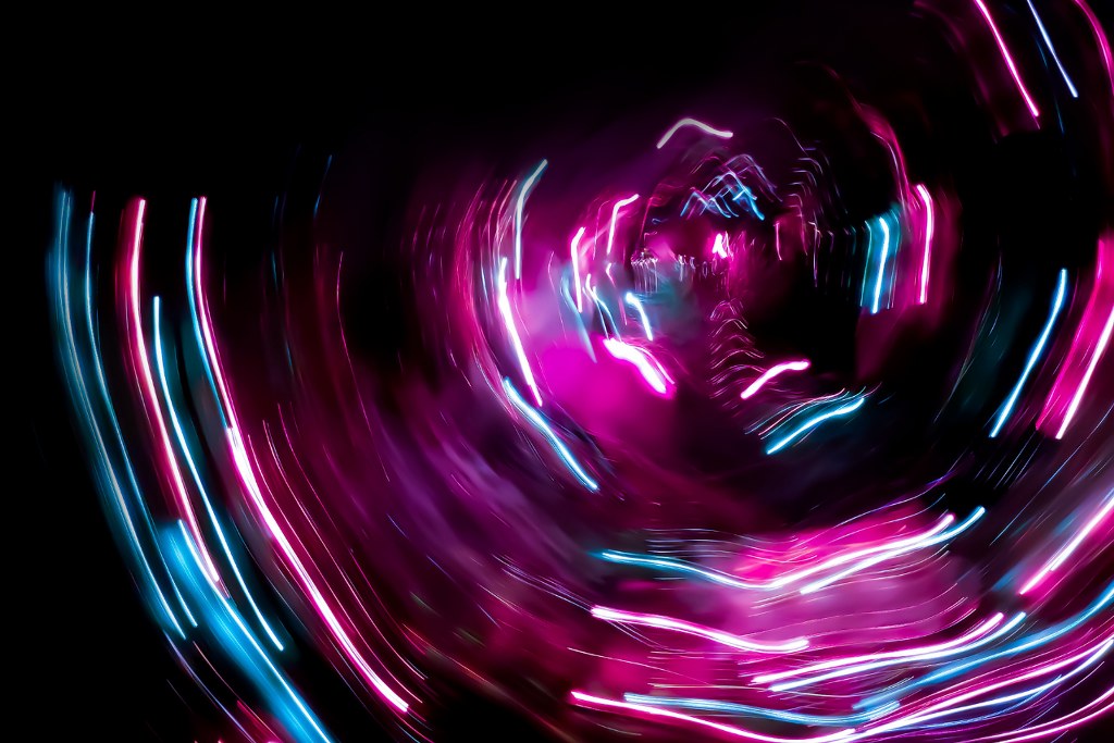 High Tech Spacecraft Flies into Space Colored Blurry Abstract Background.