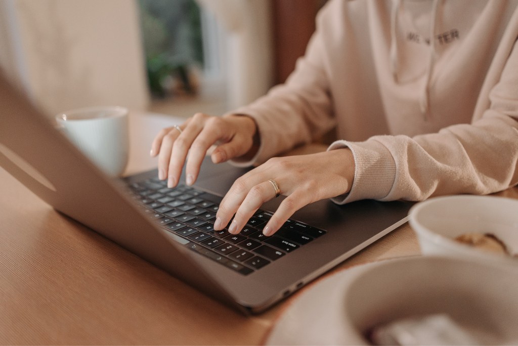 Person using laptop.