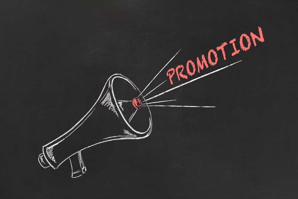 Promotion hand drawing of megaphone on blackboard.