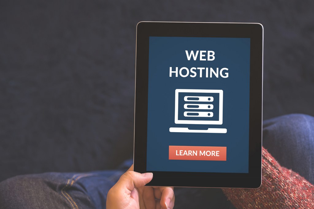 Tablet displaying Web hosting and learn more buttons.