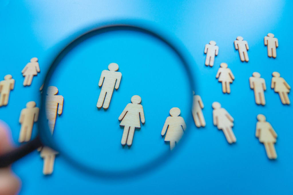 The crowd of wooden figures of people.