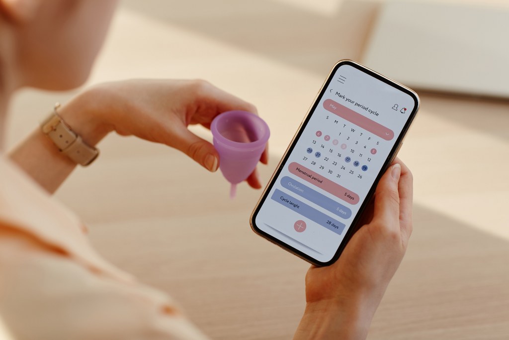 Woman using Tracking App for Menstrual Cycle.