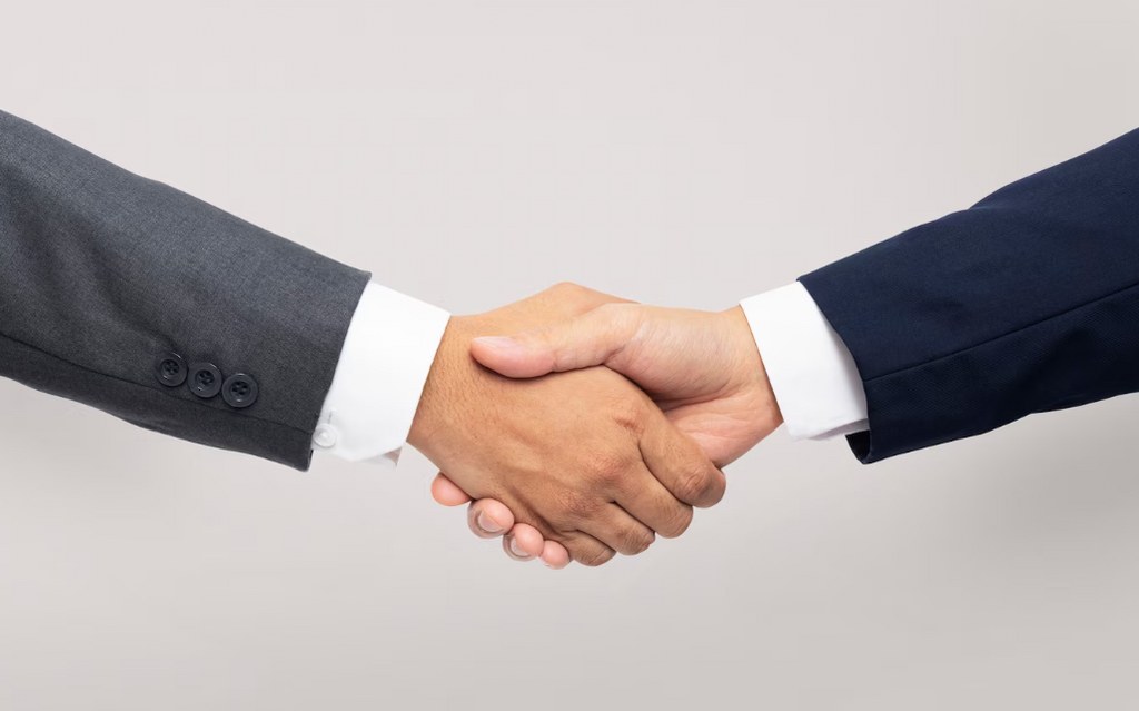 A handshake symbolizing trustworthiness and believability.