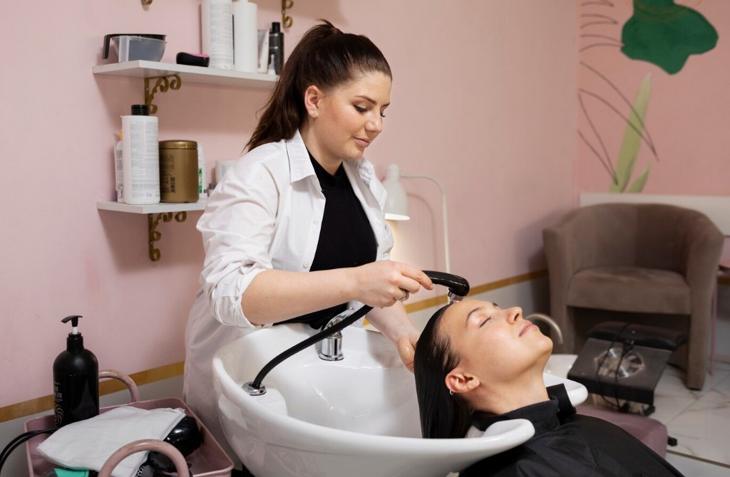 A woman being attended to in a salon.