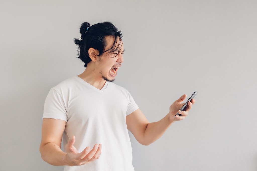 Angry Man Using Smartphone.