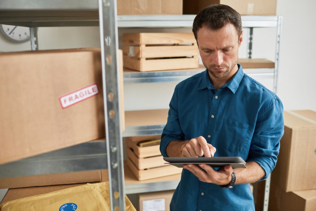 Man Managing Stock Inventory.