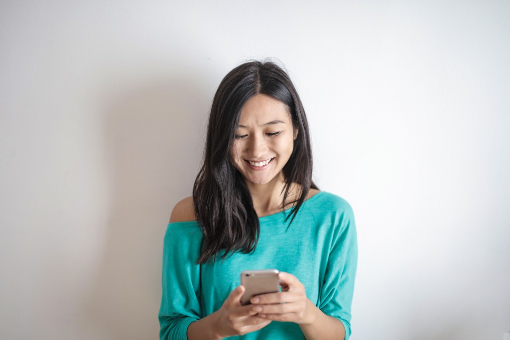 Photo of Woman Using Mobile Phone.