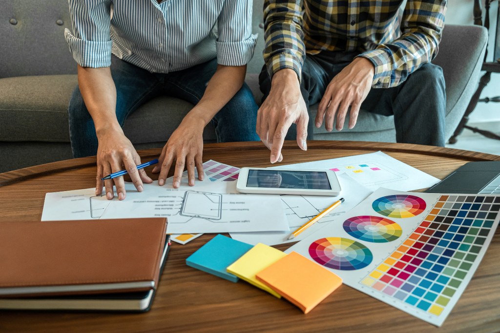 Professional Creative Team of Web Designer Planning.