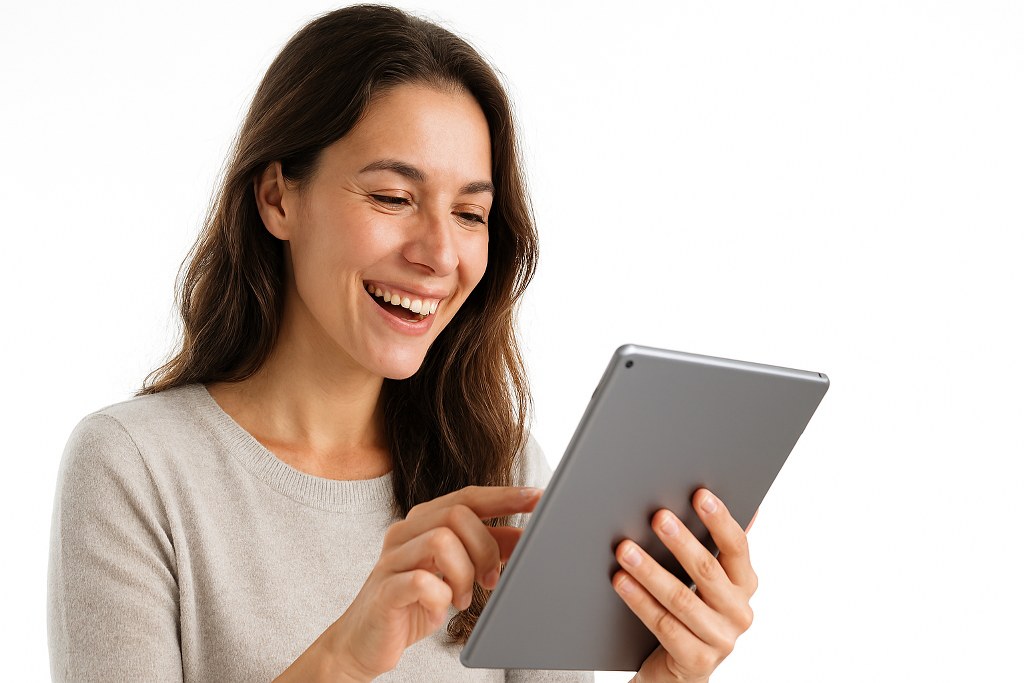 A happy woman browsing a website.