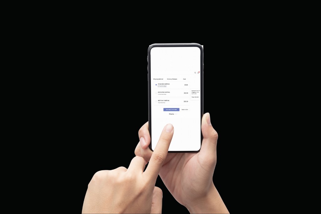 Man choosing shipping options from his phone.