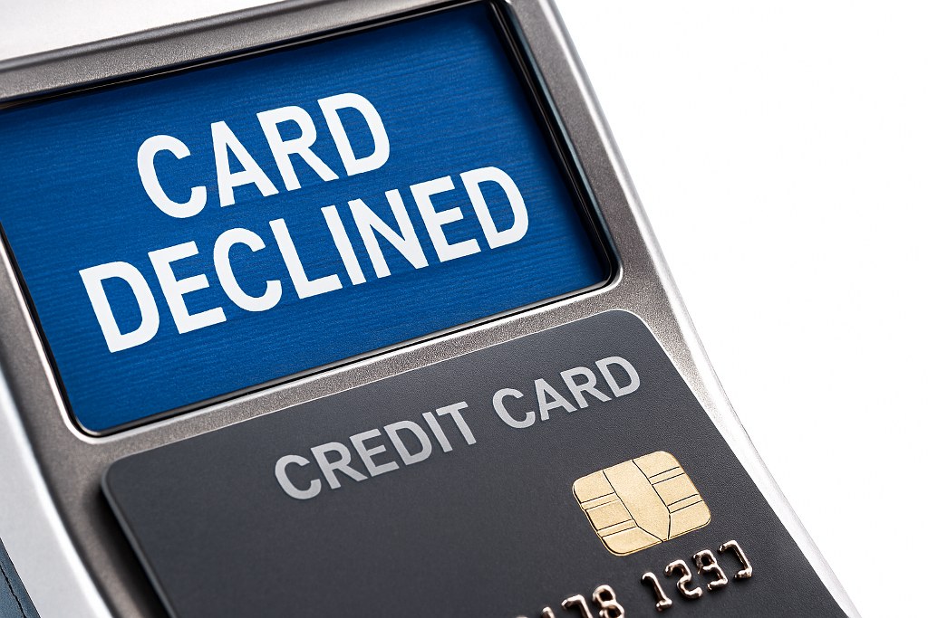A credit card declined on a reading machine.