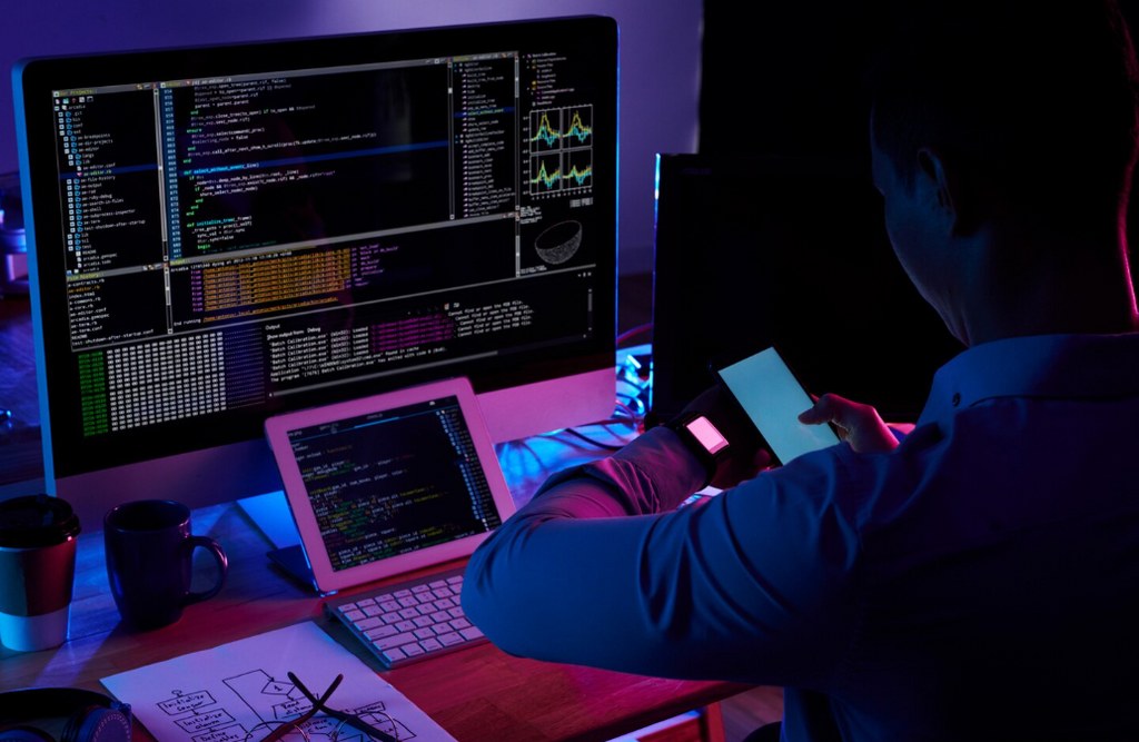 A developer coding at night.