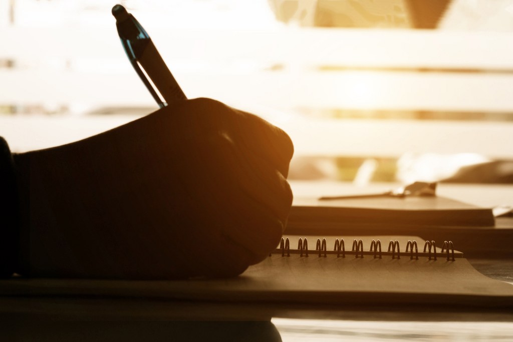 Hand writing on notebook.