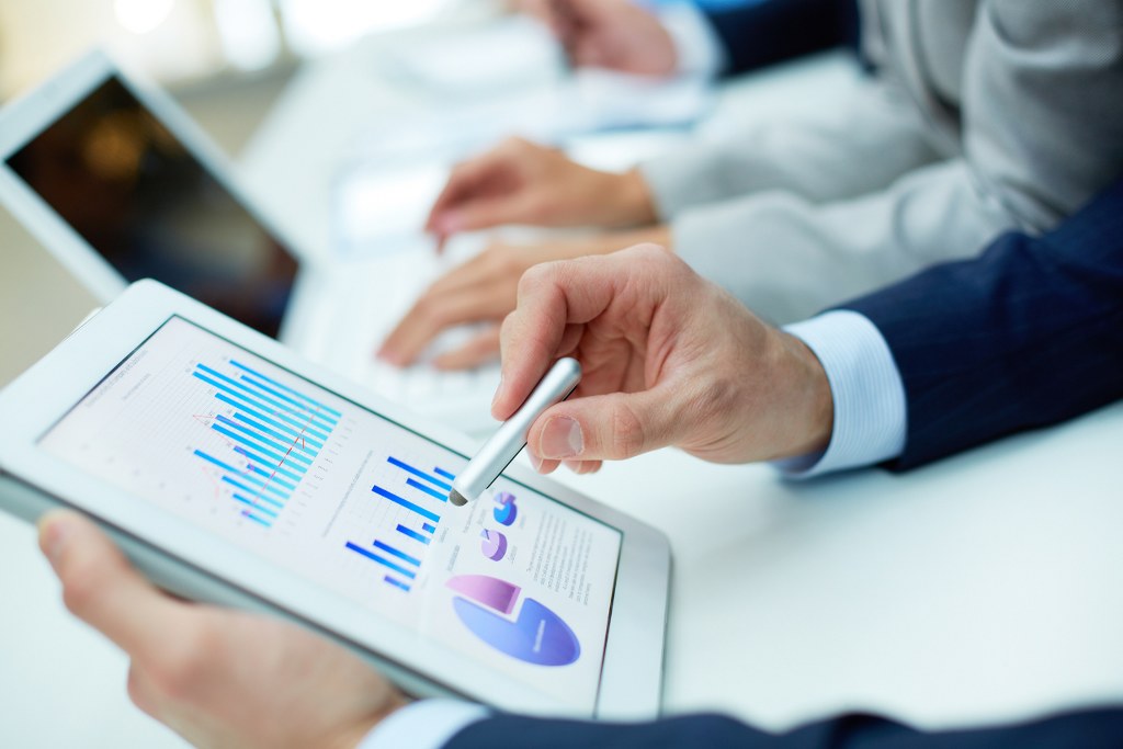 Man interacting with graphs and data.