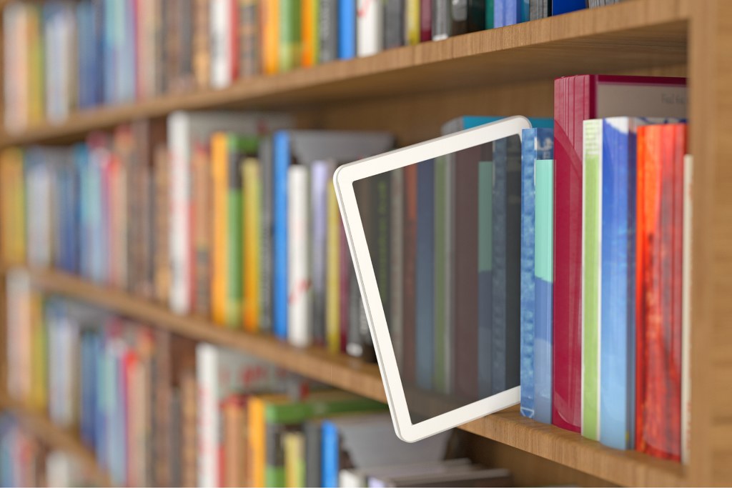 Tablet coming out of library books.