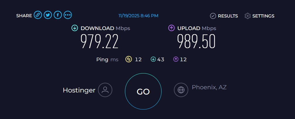 Hostinger VPS Speedtest results showing 979 Mbps download and 990 Mbps upload with 12.05 ms latency to Phoenix, Arizona
