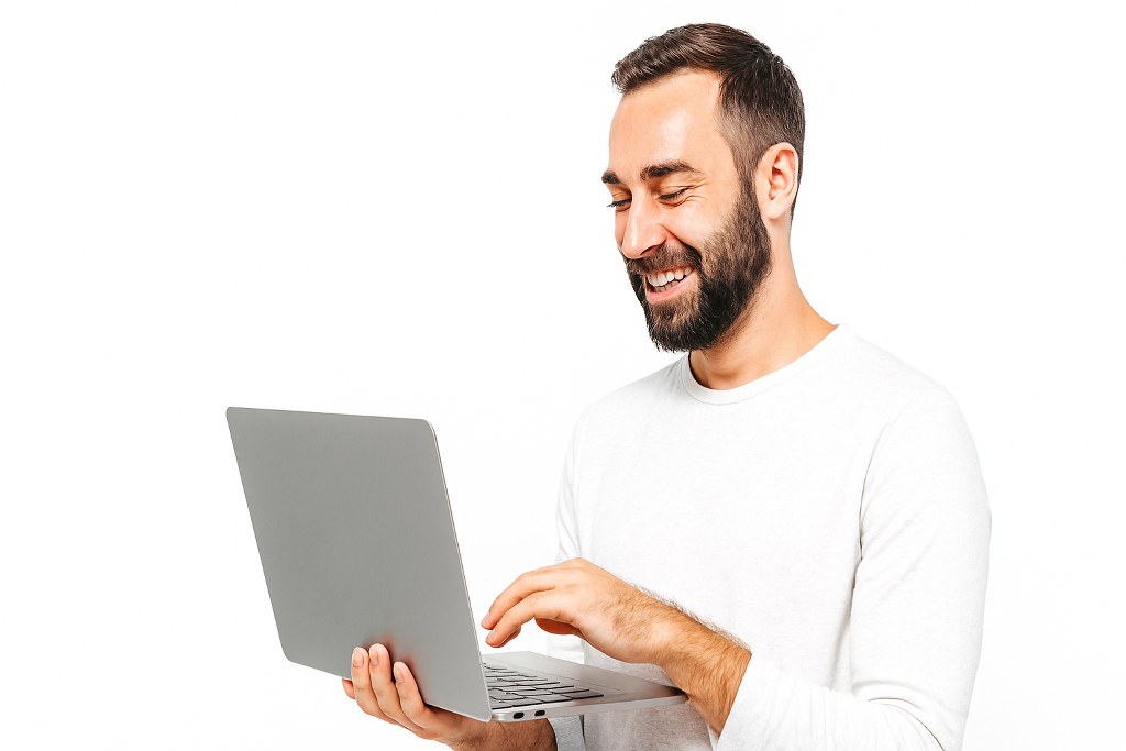 A man using his laptop.