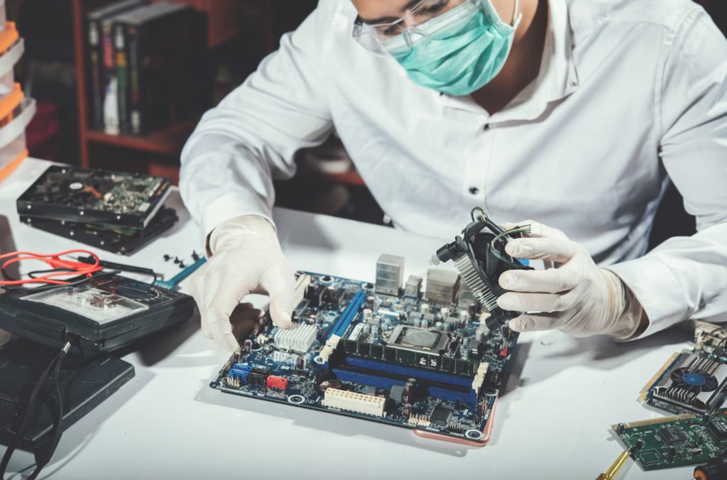A technician repairing the computer hardware.