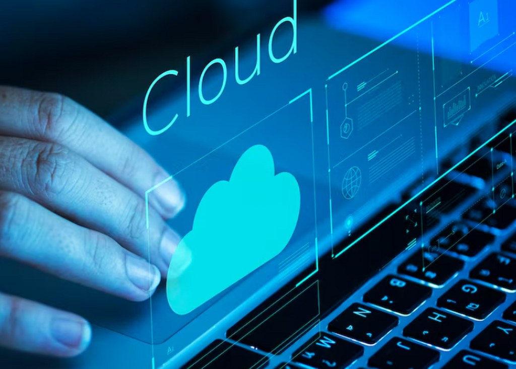 A hand hovering over a cloud icon.