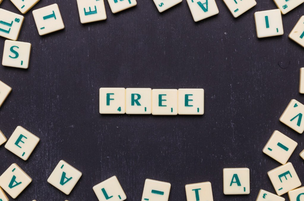 Free scrabble letters over black background.