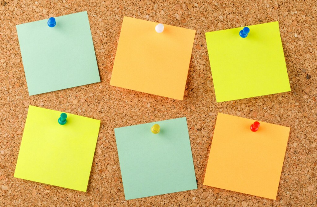 Sticky notes pinned on a surface.