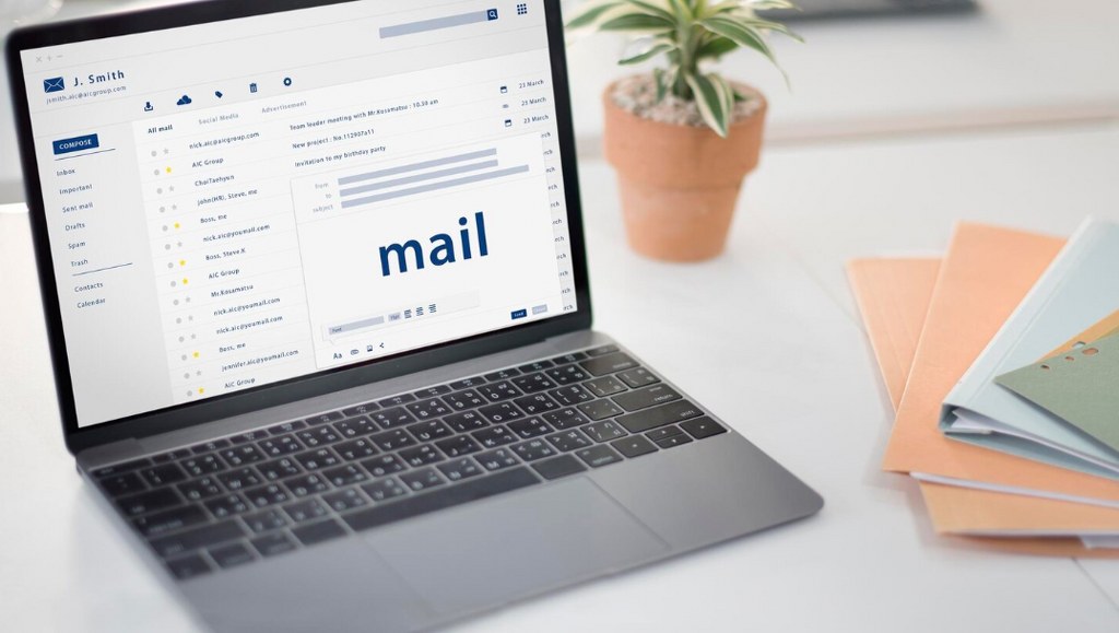 Composing an email on a laptop.