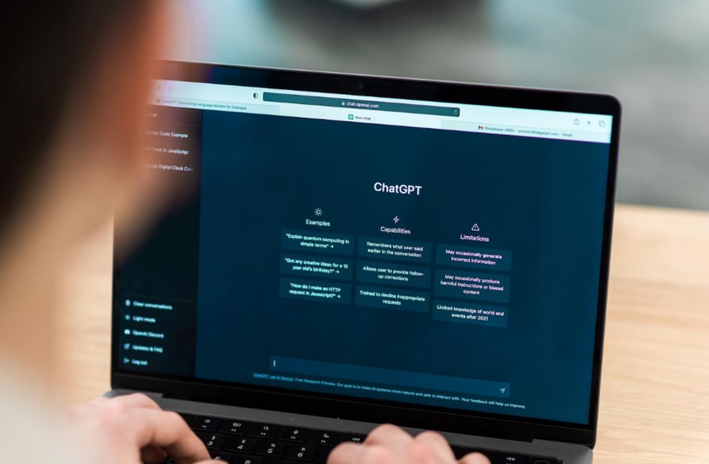 A man using ChatGPT on his laptop.