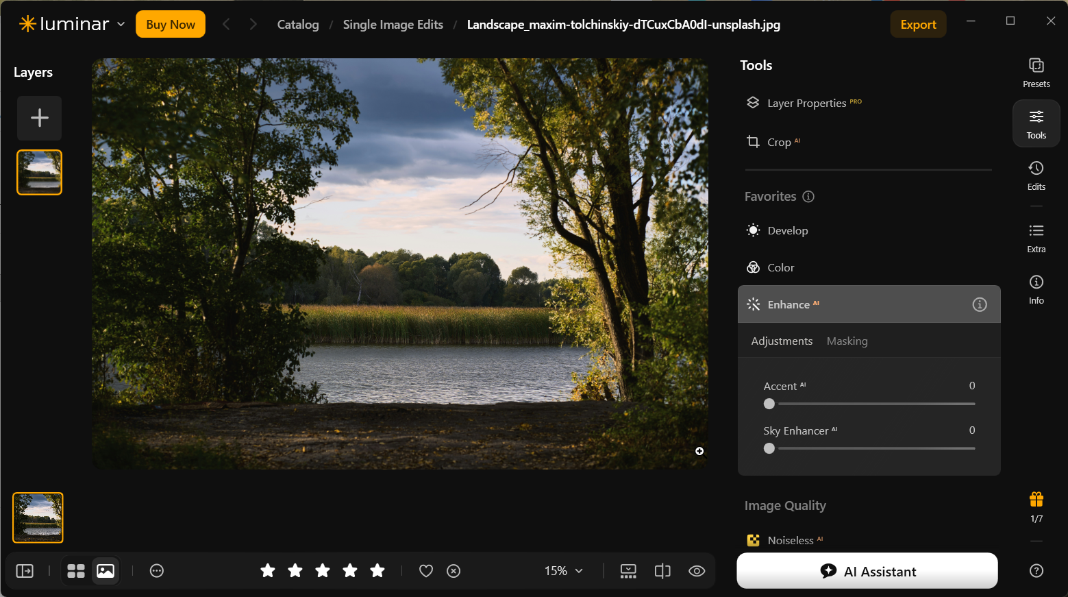 Original lake landscape in Luminar Neo, with dark foreground and trees against a cloudy sky, before Enhance AI adjustments.