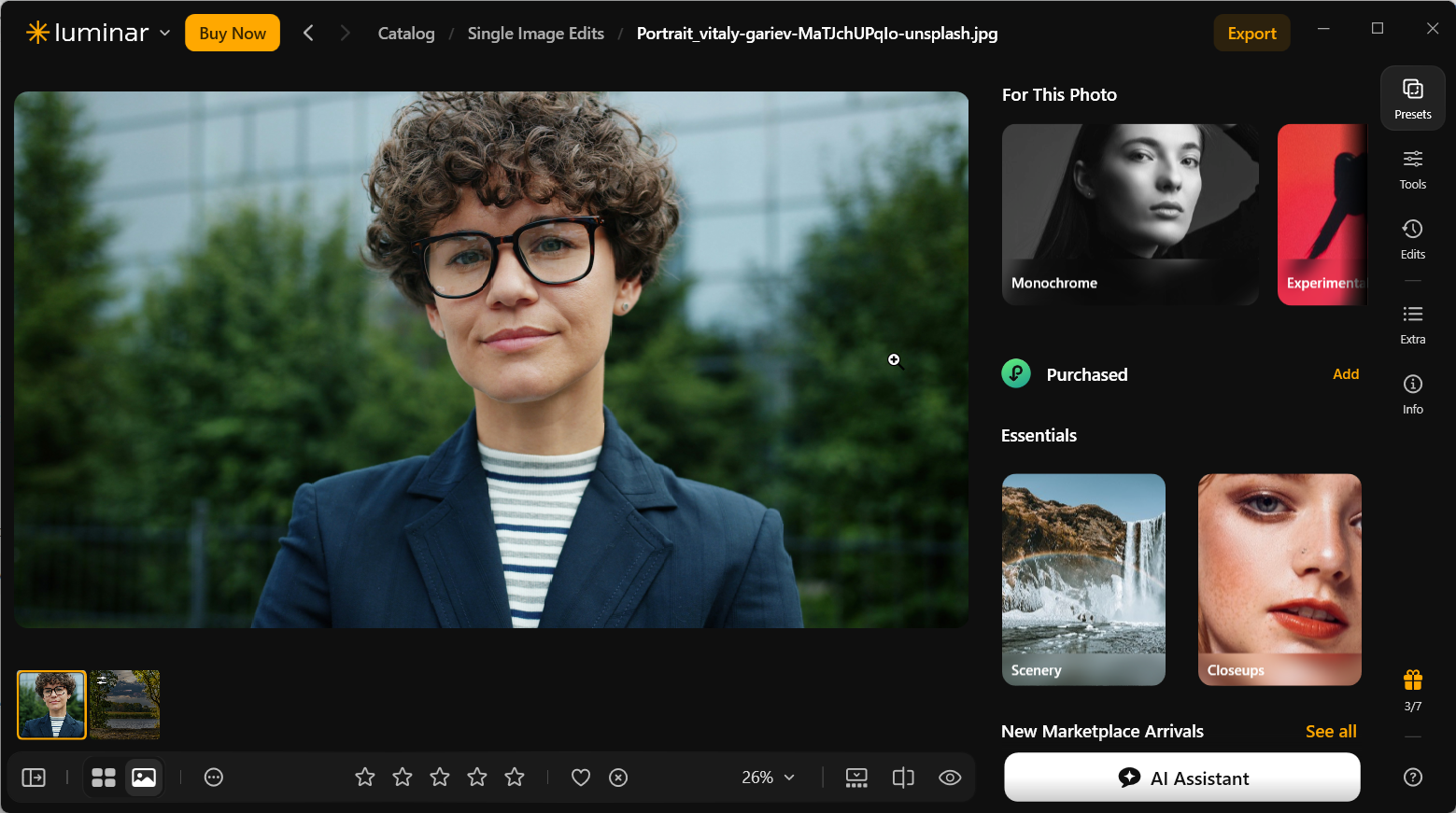Luminar Neo showing the original outdoor portrait of a person with curly hair and dark-framed glasses, alongside suggested presets.