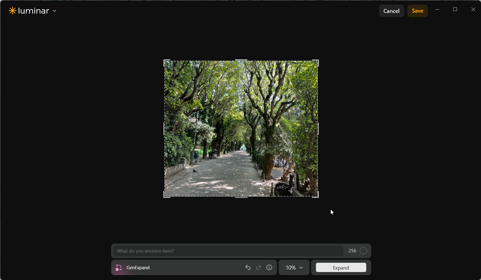 Completed Luminar Neo GenExpand preview showing additional foliage on both sides of the original tree-lined park walkway, making the overall composition more square.